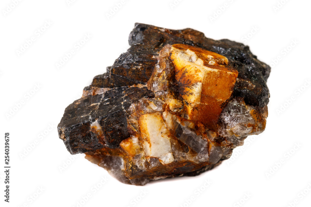 Macro of the mineral stone Columbite, Beryl, Feldspar on a white background Macro of the mineral stone Columbite, Beryl, Feldspar on a white background