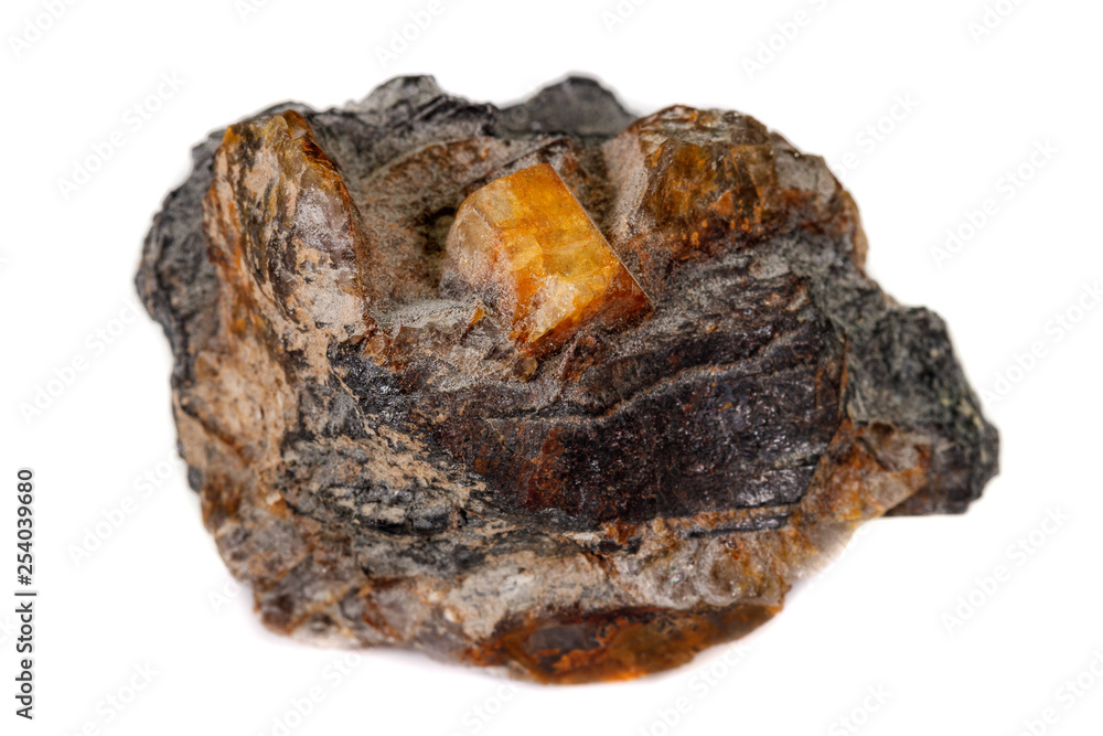 Macro of the mineral stone Columbite, Beryl, Feldspar on a white background Macro of the mineral stone Columbite, Beryl, Feldspar on a white background