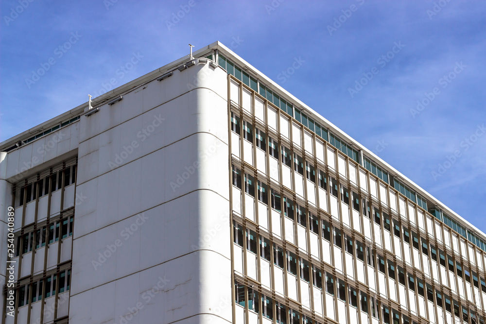 Fototapeta premium Clean shoot of modern style concrete building with blue background