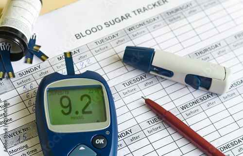 Glucometer and other instruments for measuring glucose levels on partially filled blood sugar tracker.