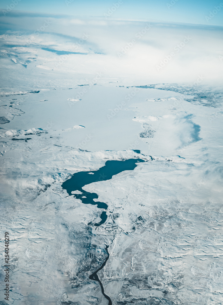 Obraz premium Aerial view of Iceland. Aerial view of amazing iceland landscapes, glacier patterns, mountains, rivers and shapes. Beautiful natural backdrop. Iceland from sky.