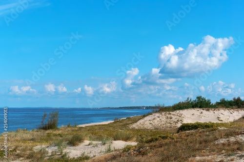 The calm sea. Turquoise seascape. Sea smoothness The sand dunes on the sea shore. the seaside in the summer.