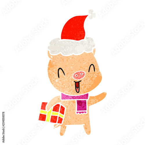happy retro cartoon of a pig with xmas present wearing santa hat