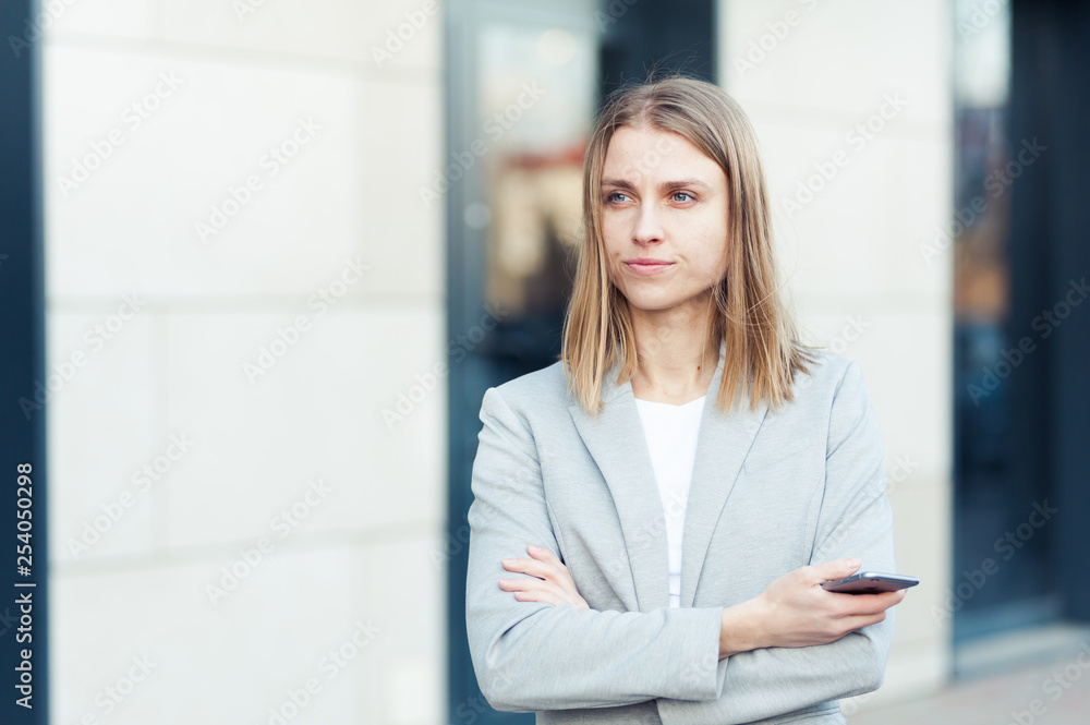 Beautiful young businesswoman using smartphone Beautiful young businesswoman using smartphone