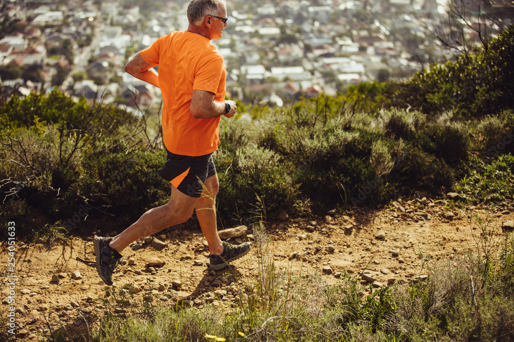 © Jacob Lund - Athletic man running on a hill © Jacob Lund - Athletic man running on a hill