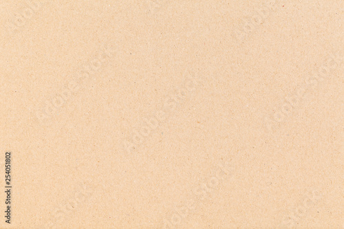Sheet of paper brown cardboard. Texture closeup, natural rough textured paper background. © bm_photo