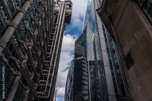 London Skyline modern architecture. Futuristic glass and concrete buildings. Looking up at futuristic London skyscrapers