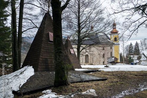 Church of Assumption with glass roof in snowy mountains country, Neratov, Orlicke hory, Eagle Mountains, Czech republic photo