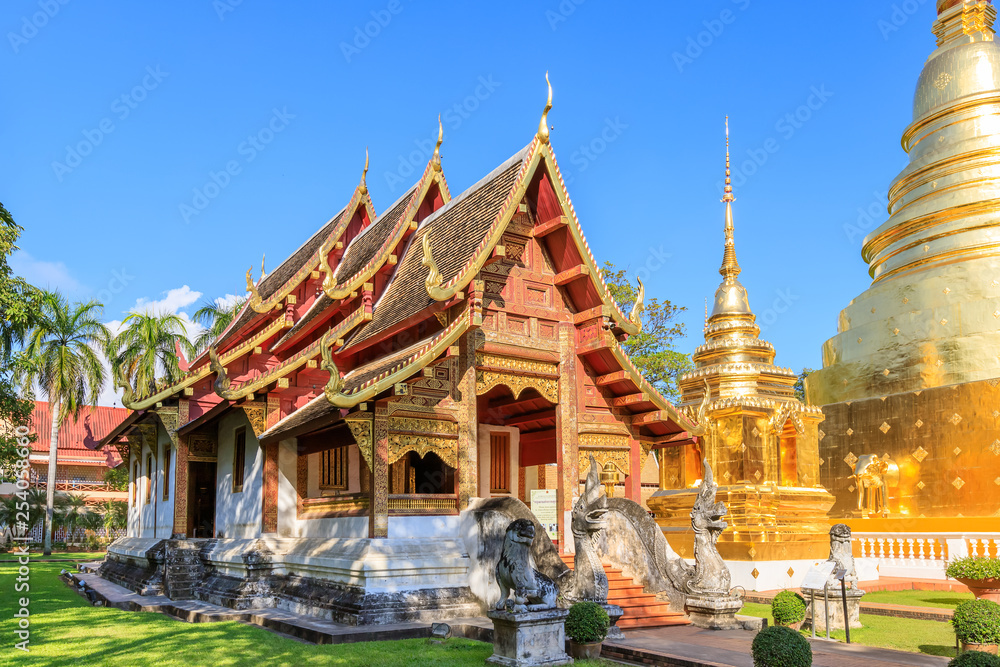 Chapel and golden pagoda at Wat Phra Singh Woramahawihan in Chiang Mai, North of Thailand