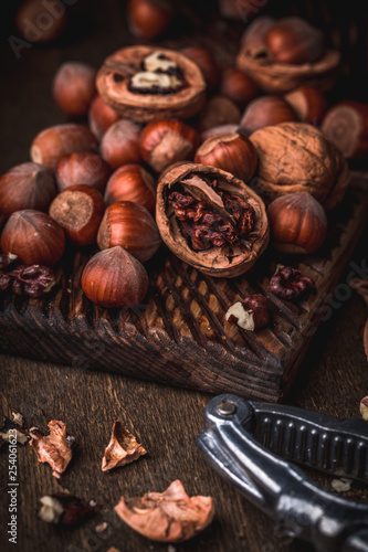 Walnuts and hazelnuts on cutting board