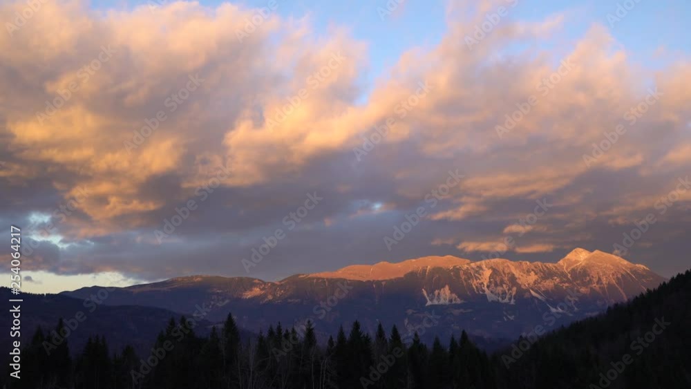 Red mountain peaks and clouds, Slovenia Red mountain peaks and clouds, Slovenia