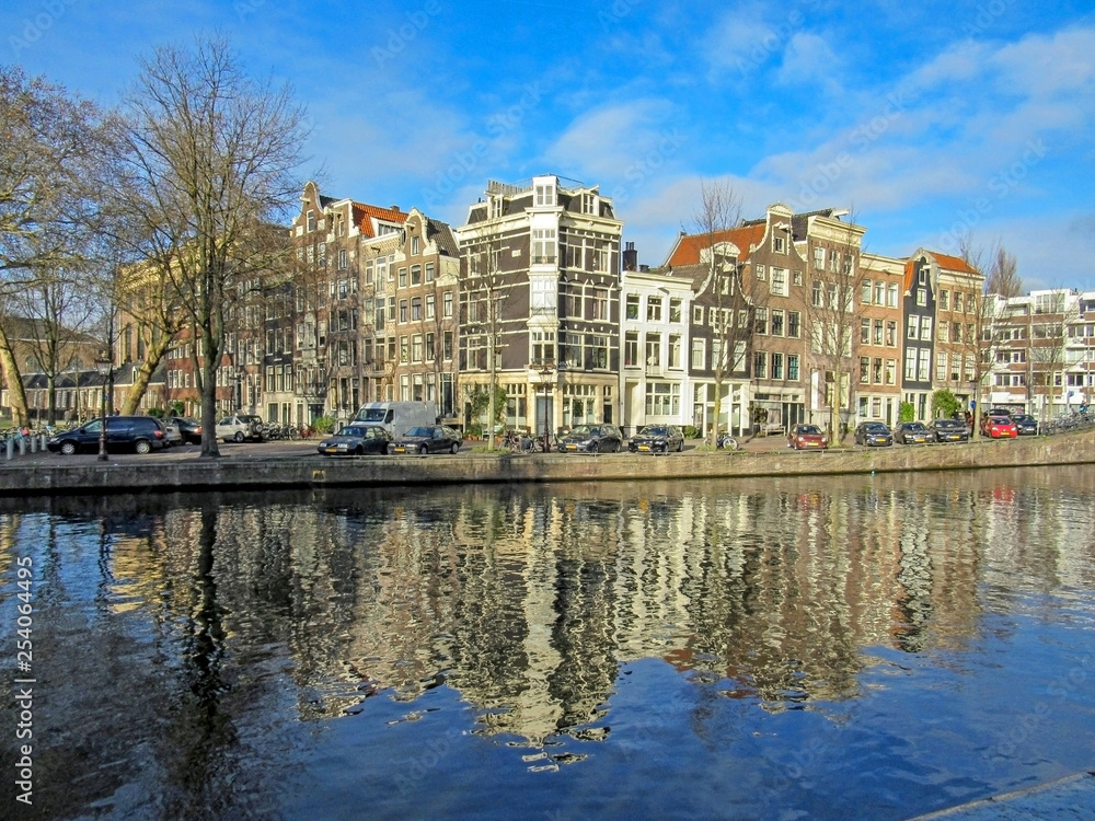 Reflection of Amsterdam in city canal