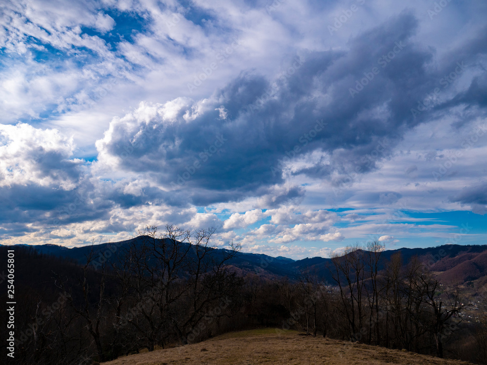 Beautiful landscape in the mountains at sunset. View of colorful sky with amazing clouds. Beautiful landscape in the mountains at sunset. View of colorful sky with amazing clouds.