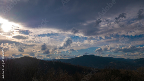 Beautiful landscape in the mountains at sunset. View of colorful sky with amazing clouds. © HAOS