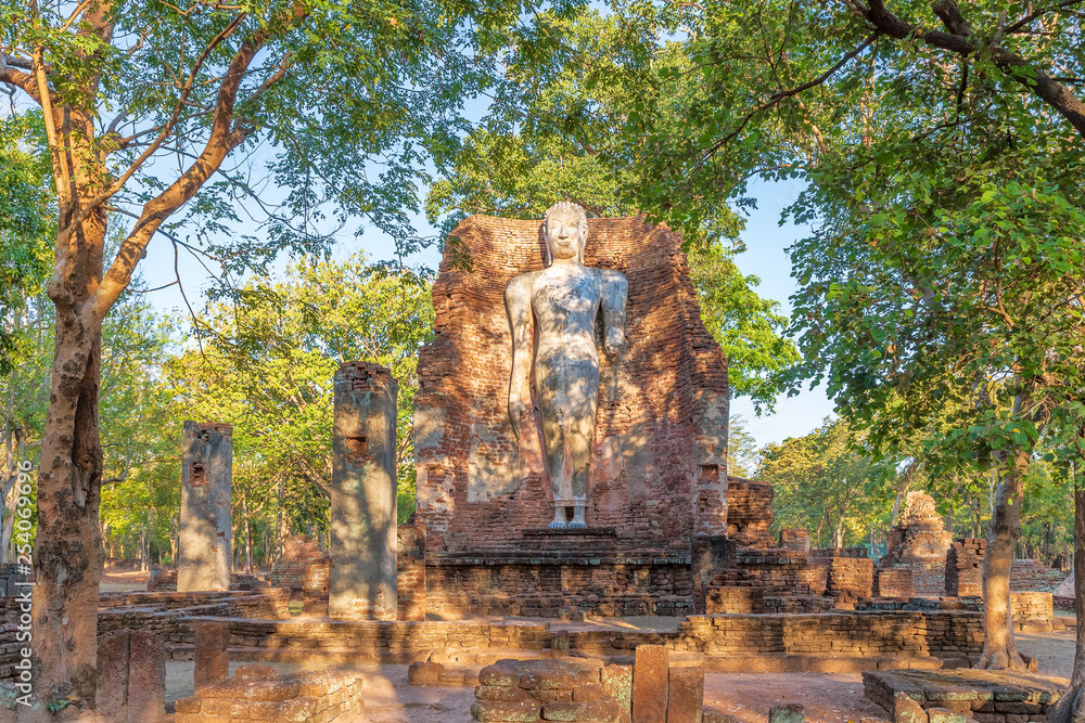 Standing Buddha statue at Wat Phra Si Ariyabot temple in Kamphaeng Phet Historical Park, UNESCO World Heritage site