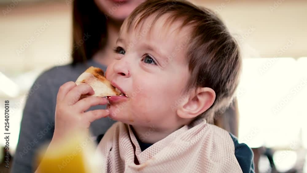 mother gives baby food from a baby spoon slow motion white mother gives baby food from a baby spoon slow motion white