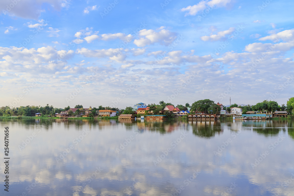 Peaceful Kamphaeng Phet town waterfront on Ping River with reflection