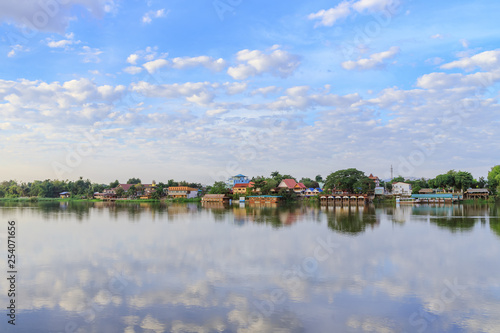 Peaceful Kamphaeng Phet town waterfront on Ping River with reflection