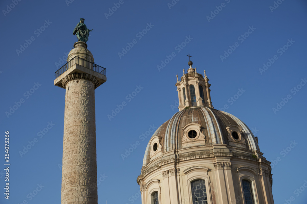 Santi Luca e Martina, church situated between the Roman Forum and the Forum of Caesar, and Trajan's Column (Italian Colonna Traiana), a Roman triumphal column. Rome, Italy Santi Luca e Martina, church situated between the Roman Forum and the Forum of Caesar, and Trajan's Column (Italian Colonna Traiana), a Roman triumphal column. Rome, Italy