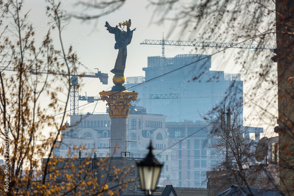 Early spring at sunny evening in warm weather. Monument of Independent. Kyiv, Ukraine Mar. 6, 2019