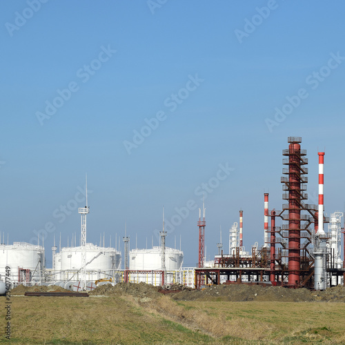 Distillation columns, pipes and other equipment furnaces refinery. photo