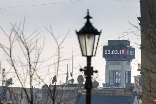 Early spring at sunny evening in warm weather. Refurbished electronic information display on the tower of the Trade Union House. Independence Square, Kyiv, Ukraine Mar. 6, 2019 © Sodel Vladyslav
