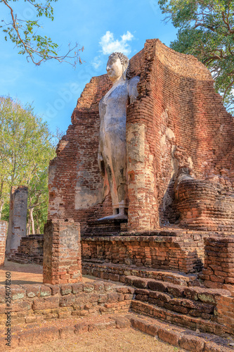 Standing Buddha statue at Wat Phra Si Ariyabot temple in Kamphaeng Phet Historical Park, UNESCO World Heritage site photo