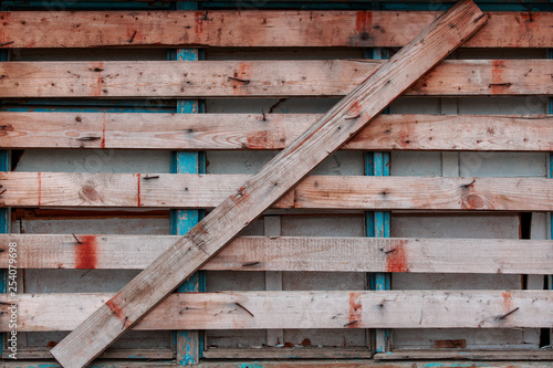 Abstract wood background with cracked paint. Can be used as a poster or background for design. Free space for inscriptions.