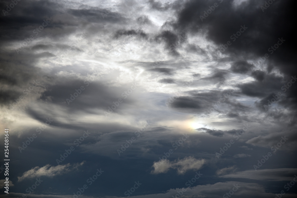 Hole of the Sky in the Dark Storm Clouds. Symbol of the struggle of good and evil. Light in the Dark and Dramatic Storm Clouds. Hole of the Sky in the Dark Storm Clouds. Symbol of the struggle of good and evil. Light in the Dark and Dramatic Storm Clouds.