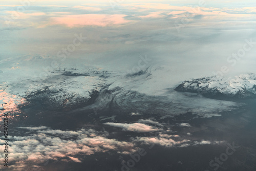 Aerial view of sunrise in winter nature landscape in north Iceland with glaciers in background. Snow Capped mountains and Glacier.