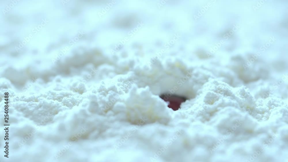 Slow motion, Red blood dropping into white cocaine powder, macro shot Slow motion, Red blood dropping into white cocaine powder, macro shot