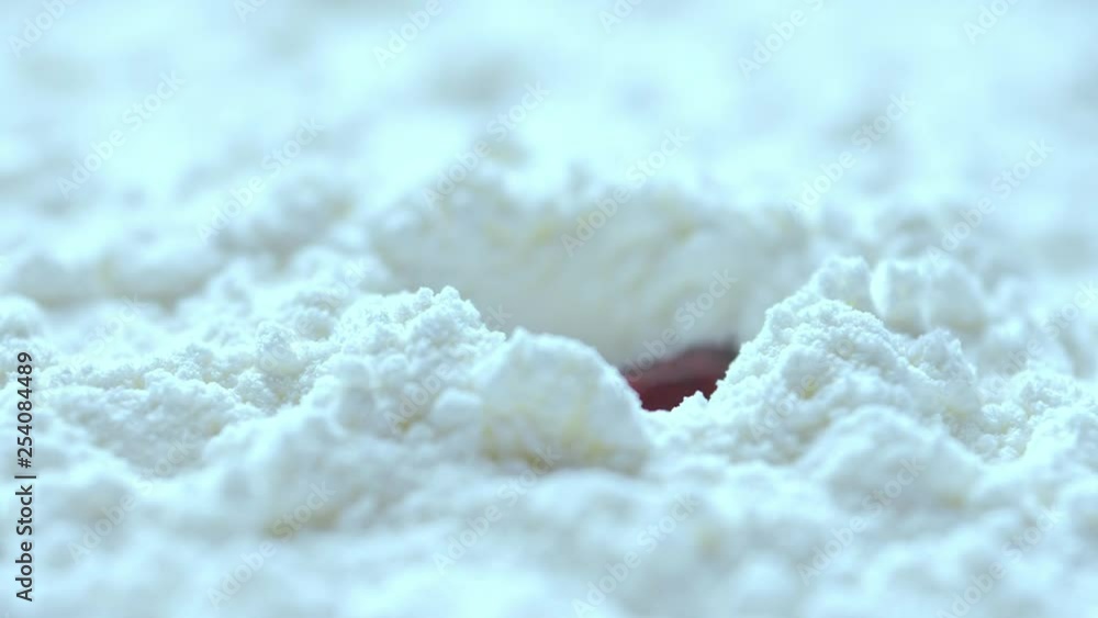 Slow motion, Red blood dropping into white cocaine powder, macro shot Slow motion, Red blood dropping into white cocaine powder, macro shot