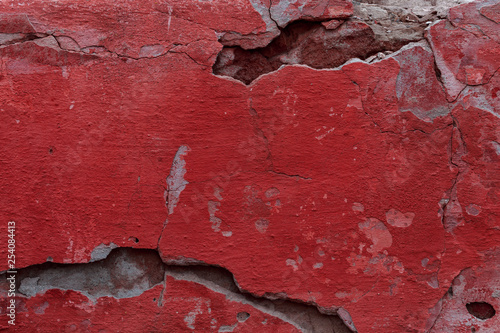 The texture of the old cement wall with scratches  cracks  dust  crevices  roughness  stucco. Can be used as a poster or background for design.