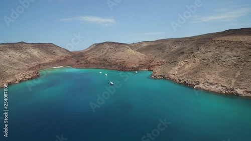 Aerial shot of a inlet, boats and little beaches in the Partida Island, Archipielago Espritu Santo National Park, Baja California Sur. photo