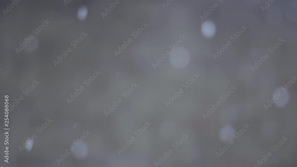 Blurred snowfall agaisnt a chilly, worn, and old brick wall as the flakes sprinkle down in smooth slow motion captured at 180fps. Peaceful and calming winter storm. Blurred snowfall agaisnt a chilly, worn, and old brick wall as the flakes sprinkle down in smooth slow motion captured at 180fps. Peaceful and calming winter storm.
