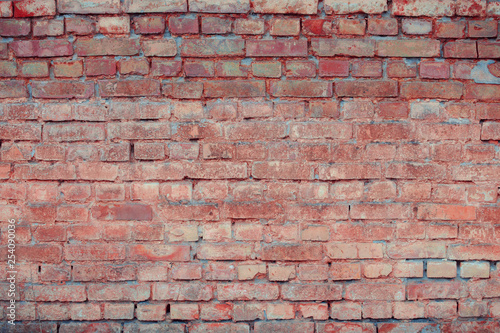 Old textured brick wall with natural defects. Scratches  cracks  crevices  chips  dust  roughness. Can be used as background for design or poster.