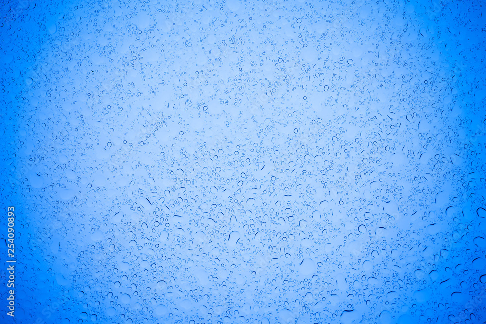 Rain droplets on blue glass background, Water drops on blue glass. Rain droplets on blue glass background, Water drops on blue glass.