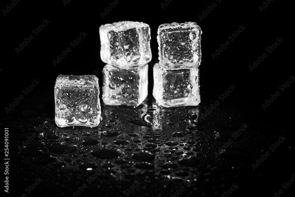 ice cubes reflection on black table background. ice cubes reflection on black table background.