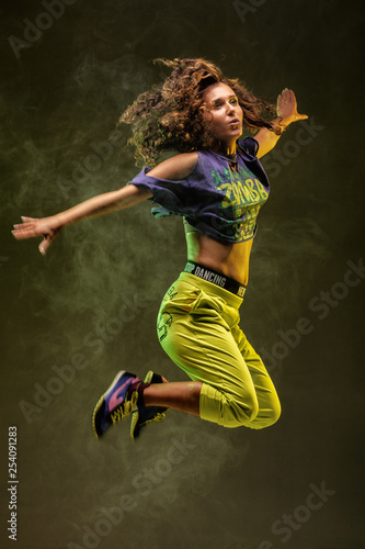 jumping zumba dancer with smoke background photo