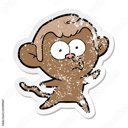 distressed sticker of a cartoon surprised monkey