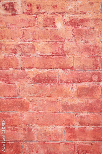 Old brick wall with scratches, cracks, dust, crevices, roughness. Can be used as a poster or background for design.