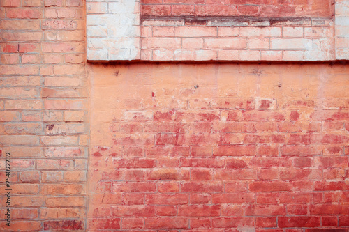 Old brick wall with scratches, cracks, dust, crevices, roughness. Can be used as a poster or background for design.