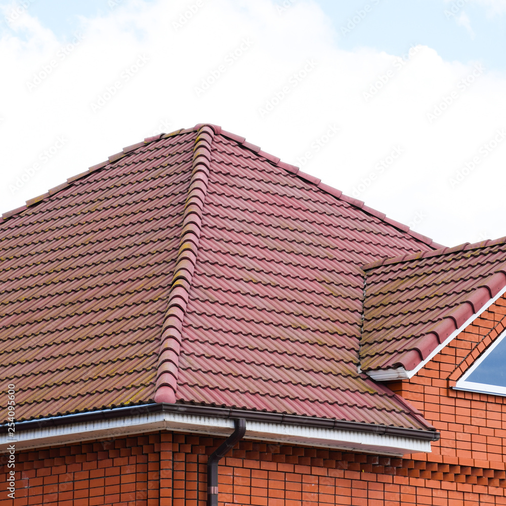 The house with a roof of classic tiles The house with a roof of classic tiles