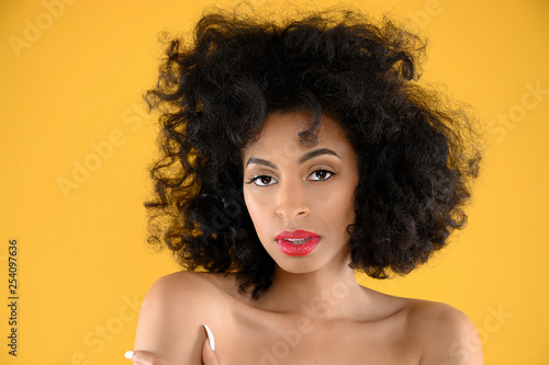 African American Woman Closeup on Yellow Background