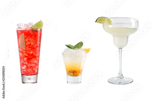 A variety of alcoholic drinks, beverages and cocktails on a white background. Three refreshing different drinks.