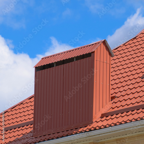 The roof of corrugated sheet red orange
