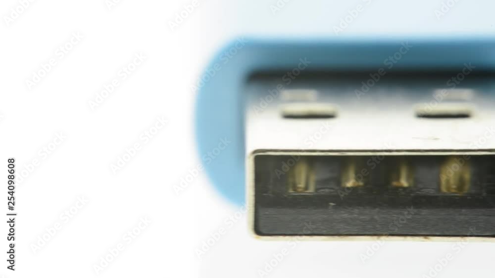 Extreme closeup of blue usb flash thumb drive - pan of connection end of usb drive Extreme closeup of blue usb flash thumb drive - pan of connection end of usb drive