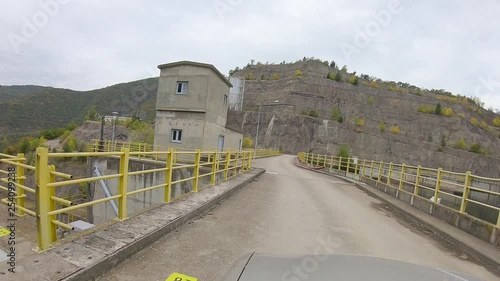 dam crossing with car photo