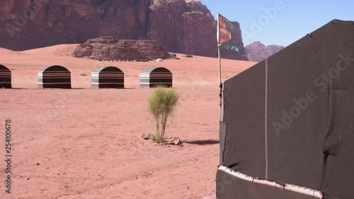 Jordan flag in wind Wadi Rum desert photo