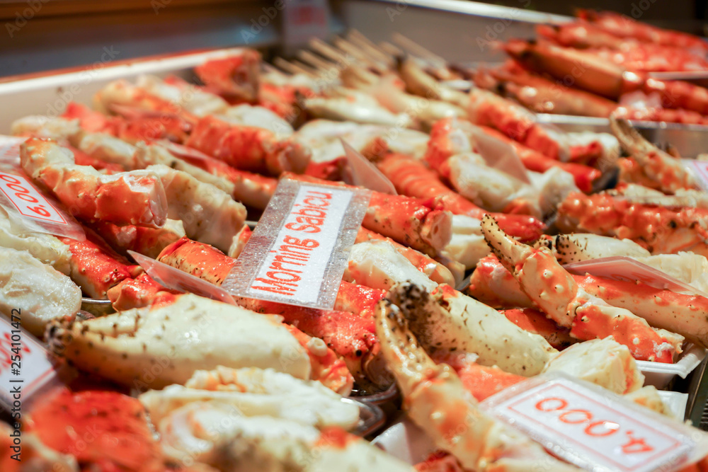 OSAKA, JAPAN, January 14, 2019 : Many roasted king crab legs and claws with name and label price, Sale in Kuromon market. It's very popular for tourists because it's very delicious. OSAKA, JAPAN, January 14, 2019 : Many roasted king crab legs and claws with name and label price, Sale in Kuromon market. It's very popular for tourists because it's very delicious.
